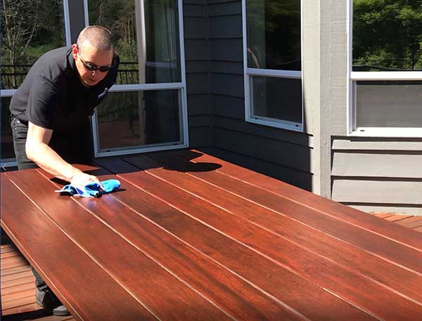Nova Blog Wiping down a Tigerwood Table with ExoShield after Two Years